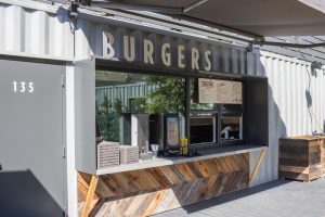 Containers can be tailored to almost any design concept. Here’s an “al fresco” burger stop with a signature California style!